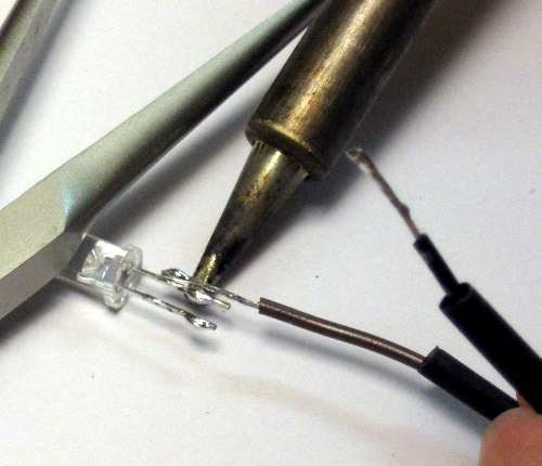 Soldering the wire to the LED lead